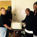 veterans holding cake