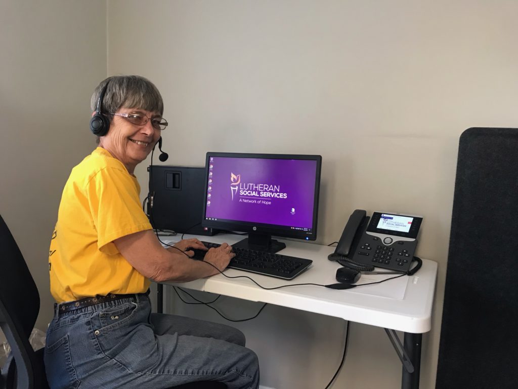 volunteer on phone and computer