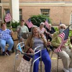 group of assisted living residents at a fourth of July event