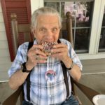 assisted living man eating donut