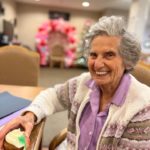 resident smiling at Valentine's Day party